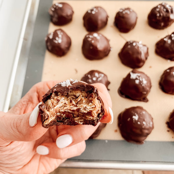 Chocolate covered peanut butter ball with bite taken out